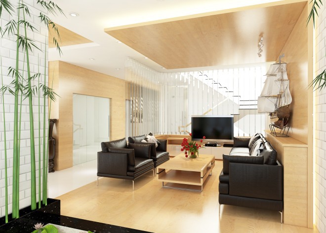 Không gian sử dụng tông màu gỗ kết hợp sofa chất liệu  ​giả da màu đen theo phong cách hiện đại