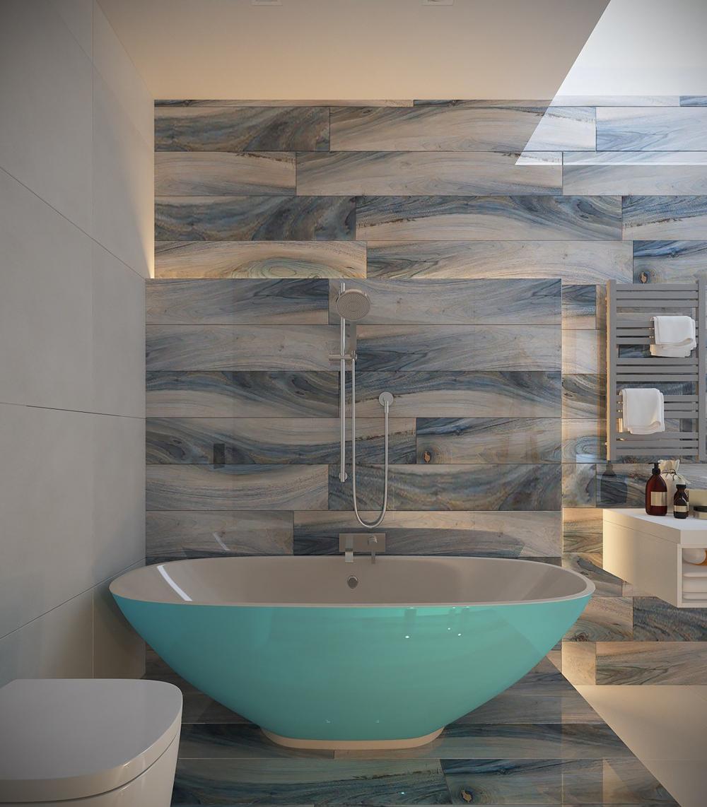 Phòng tắm trong căn hộ 2 phòng ngủ được bài trí theo chủ đề biển cả với bồn tắm màu xanh mát mắt.