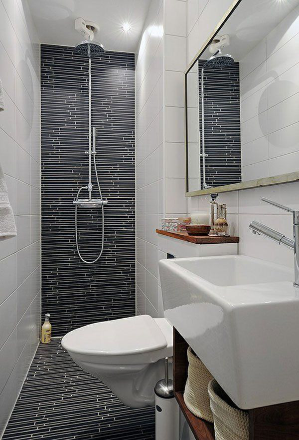 Hình ảnh phòng tắm hiện đại với bồn rửa mặt, bồn cầu màu trắng, vòi sen, gạch ốp đen