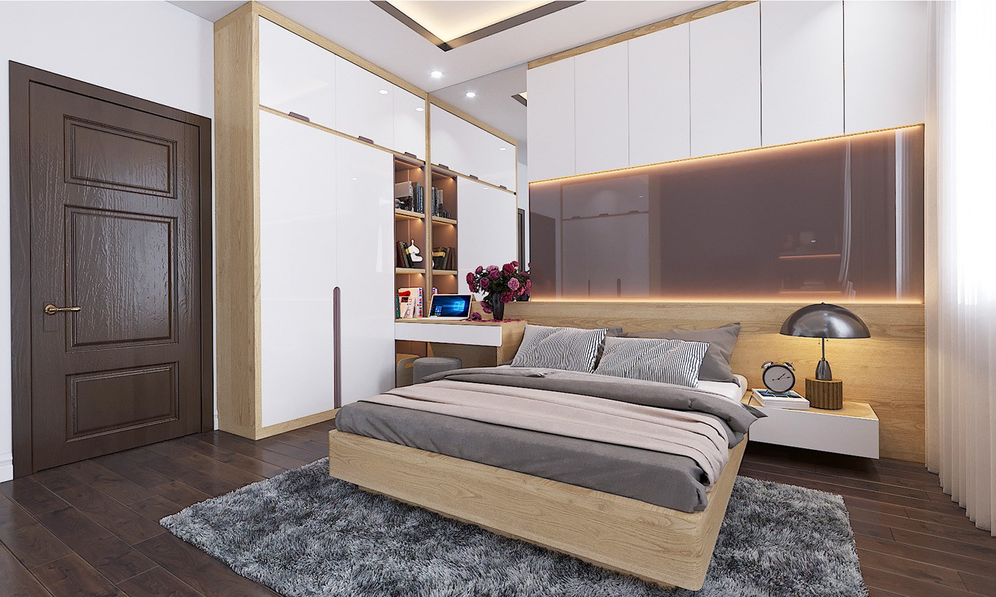 Hình ảnh không gian ngủ nghỉ thứ ba trong nhà phố được bài trí đơn giản với nội thất gỗ chủ đạo, kết hợp ăn ý cùng đèn LED trang trí, gương phủ kính.