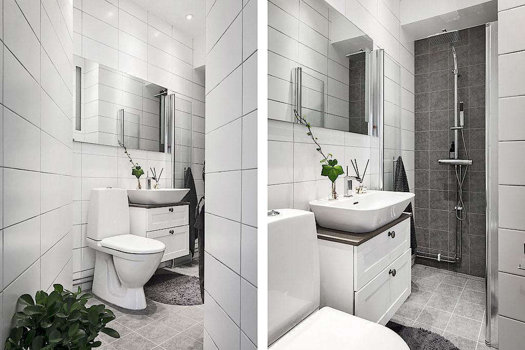 Hình ảnh phòng tắm sử dụng gạch ốp, lát màu trắng tinh khôi, gương lớn gắn tường, chậu cảnh trang trí