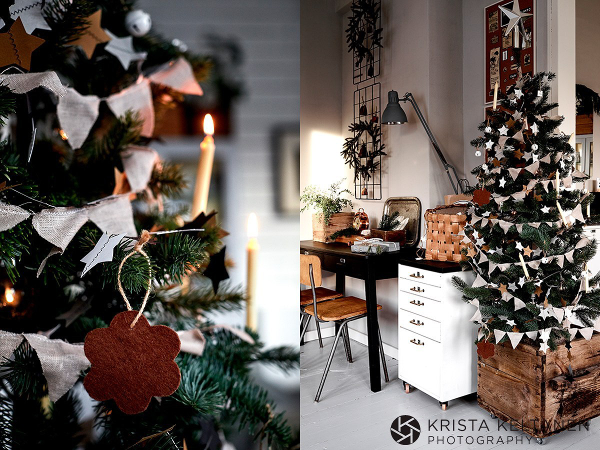 Hình ảnh cận cảnh cây thông Noel, góc phòng với bàn ghế gỗ, tủ ngăn kéo