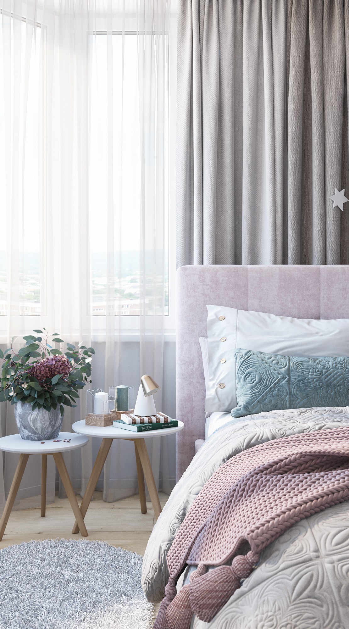 Hình ảnh cận cảnh đầu giường ngủ với bộ đôi bàn tròn đặt bình hoa trang trí, ga gối tông màu pastel, rèm cửa màu trắng mỏng mảnh
