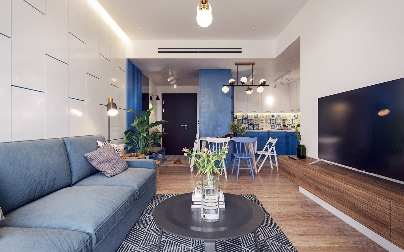 Hình ảnh toàn cảnh phòng khách với sofa xanh dương, tủ kệ tivi bằng gỗ xám, liền kề phòng ăn và khu bếp