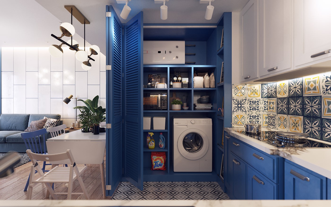 Hình ảnh cận cảnh tủ bếp âm tường màu xanh dương là nơi giấu gọn thiết bị nấu nướng và máy giặt, bên cạnh là bếp nấu, bên còn lại giáp bàn ăn, phòng khách.