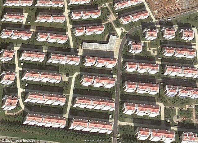 Rows of neat, newly-built houses like these in Jiangsu are becoming more common in China Read more: http://www.dailymail.co.uk/news/article-2005231/Chinas-ghost-towns-New-satellite-pictures-massive-skyscraper-cities-STILL-completely-empty.html#ixzz1PjCYHoBt