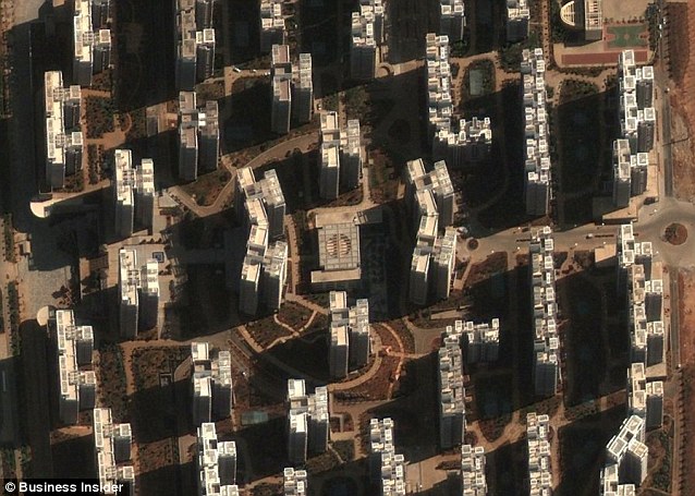 These skyscraper in Chenggong, where there are already 100,00 new homes, should be bustling with life but are instead empty Read more: http://www.dailymail.co.uk/news/article-2005231/Chinas-ghost-towns-New-satellite-pictures-massive-skyscraper-cities-STILL-completely-empty.html#ixzz1PjDmskKn