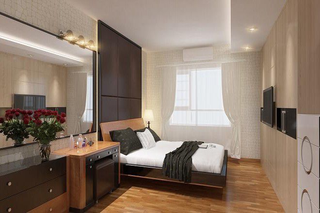 Phòng ngủ master với đầu giường nhấn nhá bằng chất liệu khung gỗ bọc da giả.