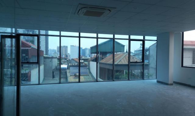 Bán toà nhà văn phòng phố Thái Hà, Đống Đa lô góc 8 tầng thông sàn, thang máy DT 70m2, MT 8m, 28 tỷ