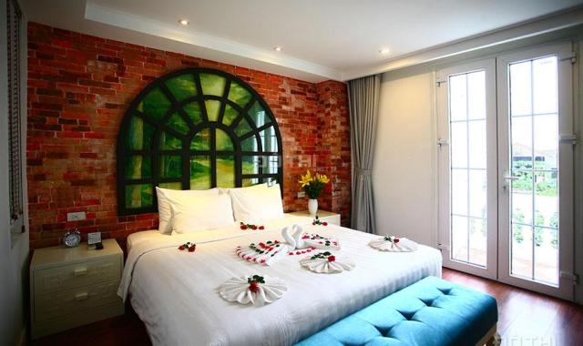 Bán tòa khách sạn phố Trần Hưng Đạo, DT 93m2 x 9 tầng thang máy, MT 7.8m.