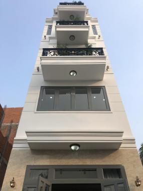 Nhà mới có thang máy, 1 trệt 4 lầu, đường Hà Huy Giáp. Gần cao đẳng Điện Lực