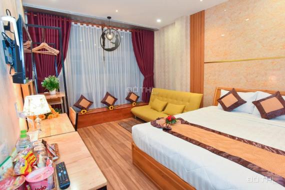 Bán khách sạn ngay bến Ninh Kiều, đường Lê Thánh Tôn, trệt 5 lầu, 16 phòng, dt: 3,5x21m, nở hậu