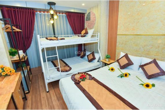 Bán khách sạn ngay bến Ninh Kiều, đường Lê Thánh Tôn, trệt 5 lầu, 16 phòng, dt: 3,5x21m, nở hậu