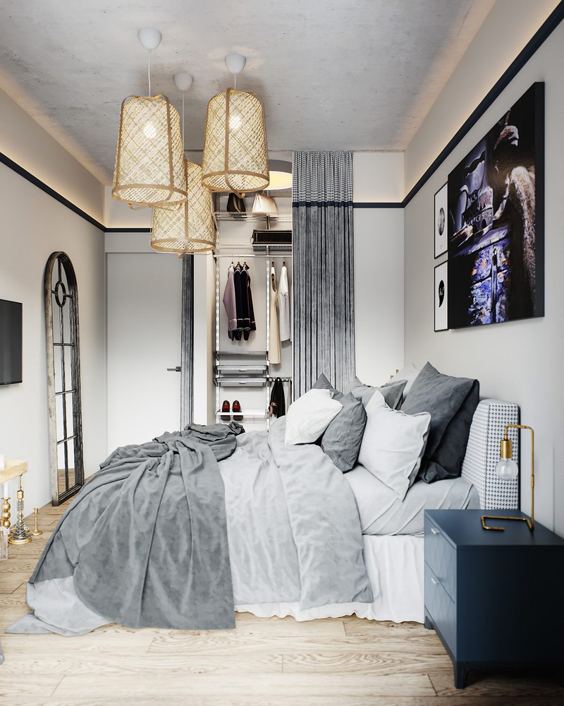 Hình ảnh không gian phòng ngủ được trang trí khá ấn tượng với bộ ba đèn chùm có phần chụp làm bằng chất liệu mây đan mộc mạc.