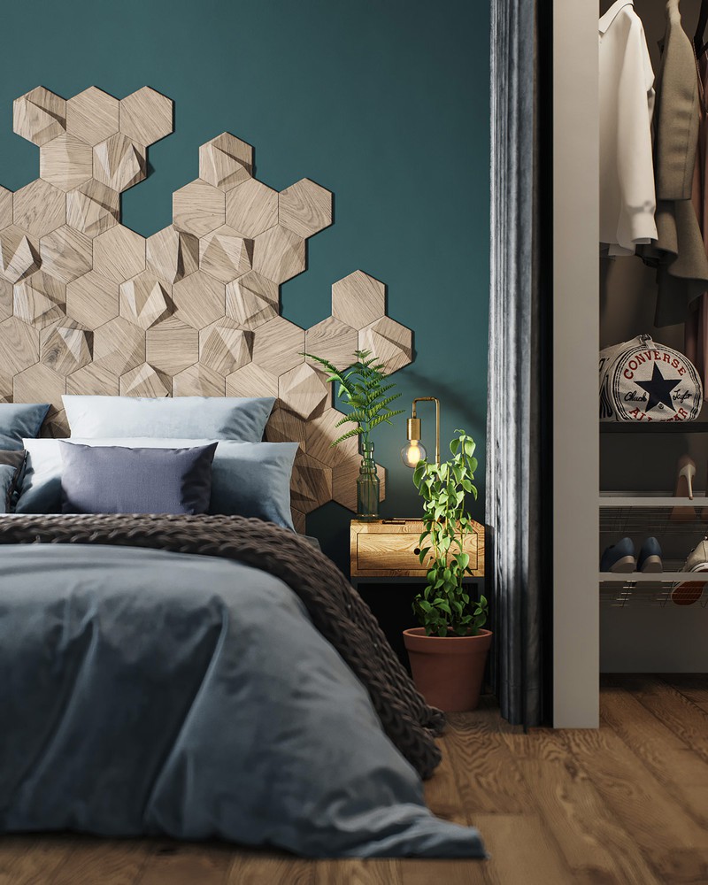 Hình ảnh bức tường đầu giường ngủ được trang trí bằng những mảng gỗ họa tiết tổ ong bắt mắt, nổi bật trên phông nền màu xanh ngọc.