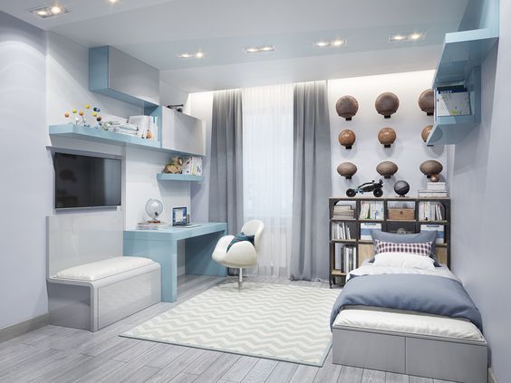 Hình ảnh phòng ngủ của con trai với sắc trắng, xanh dương chủ đạo, giường đơn, giá sách đầu giường, bàn học và giá sách gắn tường