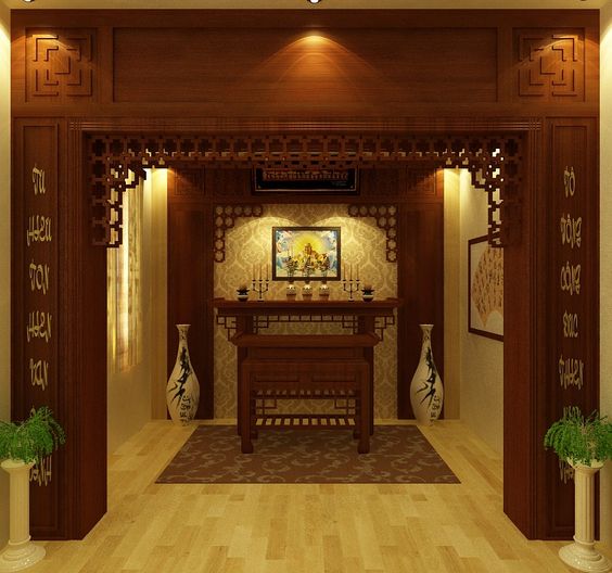 Hình ảnh một phòng thờ nghiêm trang, sử dụng nội thất gỗ màu cánh gian chủ đạo, lộc bình trang trí đối xứng