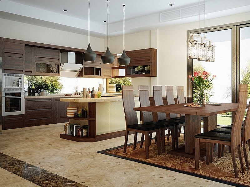 Hình ảnh toàn cảnh phòng bếp, bàn ăn với nội thất gỗ sẫm màu chủ đạo, đèn thả trần trang trí bắt mắt.