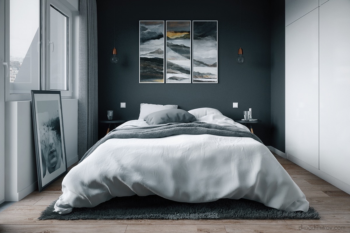 Không gian phòng ngủ được bài trí đơn giản mà cá tính với bức tường xám đậm, cùng tông với thảm trải, khung tranh trang trí.
