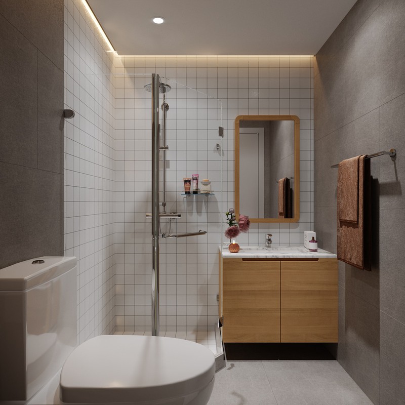 Hình ảnh phòng tắm hiện đại với bồn rửa, bồn cầu ở ngoài, tách biệt khu tắm đứng bằng vách kính trong suốt, tường ốp gạch màu trắng.
