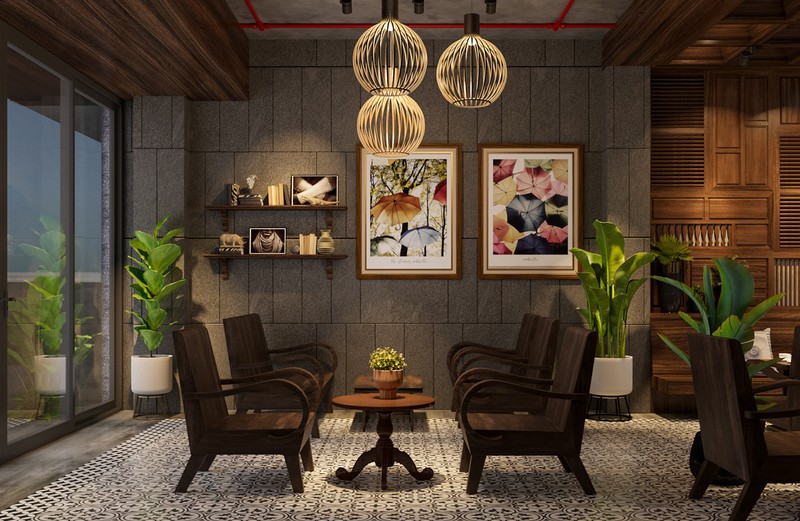 Hình ảnh cận cảnh đèn lồng bổ sung ánh sáng cho khu vực ngồi uống cà phê, phía dưới là bộ bàn ghế gỗ cũ kỹ, tranh tường trang trí, chậu cảnh xanh mướt
