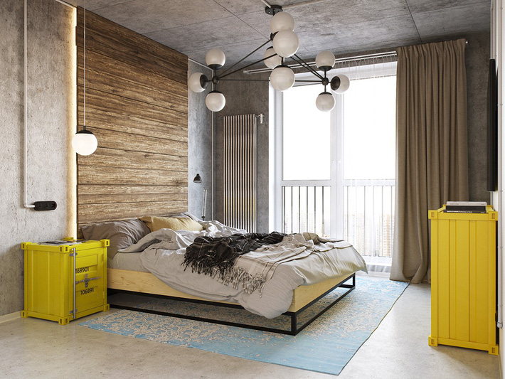 Hình ảnh phòng ngủ phong cách đương đại tối giản với tường, trần bê tông xám, điểm nhấn là tủ đồ màu vàng cạnh giường