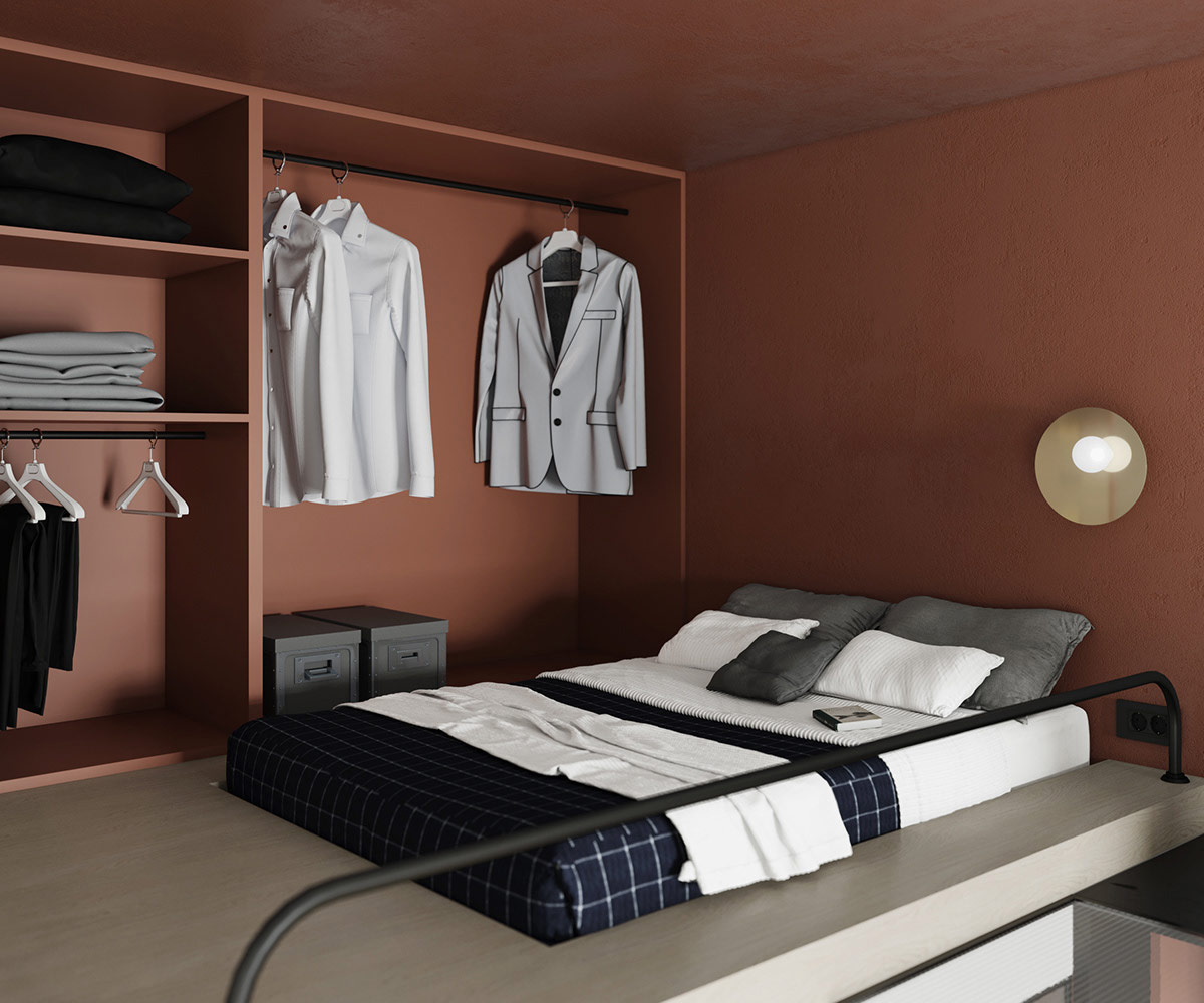 Phòng ngủ trên gác lửng với nệm bọc ga kẻ sọc màu xanh than, tủ âm tường kiểu mở treo quần áo