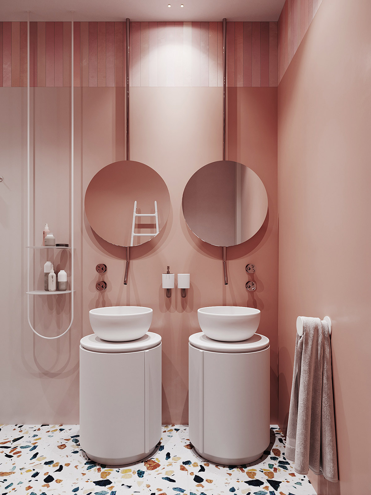 Hình ảnh một góc phòng tắm với tường sơn màu cam san hô, 2 gương tròn, phía dưới là hai bồn rừa tròn đặt trên các trụ màu trắng.