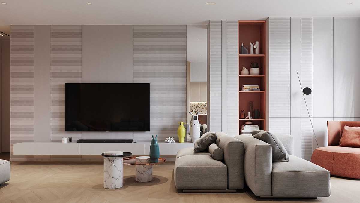 Hình ảnh một góc phòng khách với kệ tivi màu trắng, sofa màu ghi, kệ tủ sách