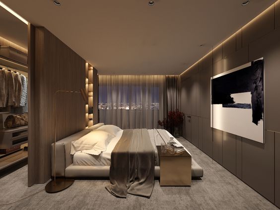 Hình ảnh toàn cảnh phòng ngủ master với giường đôi lướn, phía sau đầu giường là khu vực thay đồ tiện nghi, đối diện là tủ quần áo âm tường