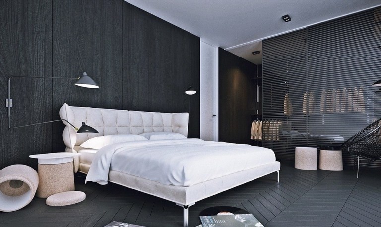 Hình ảnh toàn cảnh phòng ngủ tích hợp thay đồ tông màu đen đá với cửa chớp phân tách giữa hai khu vực chức năng, đèn sàn đầu giường ngủ màu trắng tinh khôi