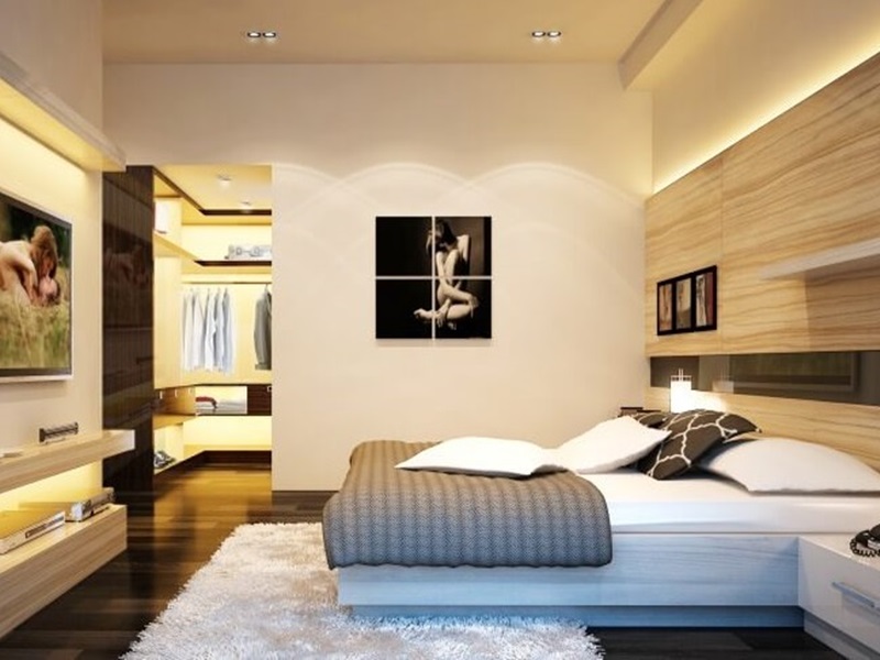 Hình ảnh phòng ngủ hiện đại với giường nệm màu trắng, tranh nghệ thuật treo tường, tủ kệ tivi, sau vách trượt là phòng thay đồ tiện nghi