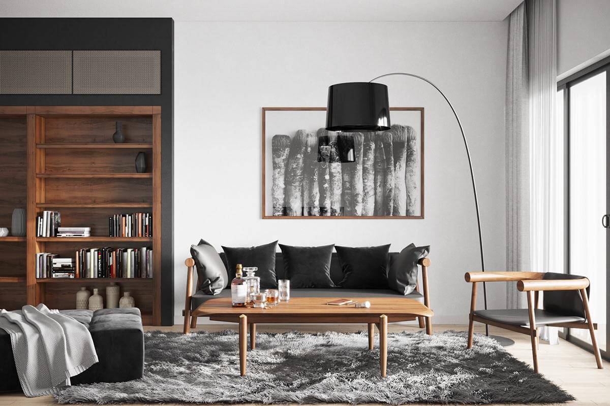 Hình ảnh phòng khách ấn tượng với tường và trần màu trắng, sàn gỗ ấm áp, sofa đen, bàn trà gỗ đặt trên thảm trải lông mềm mại