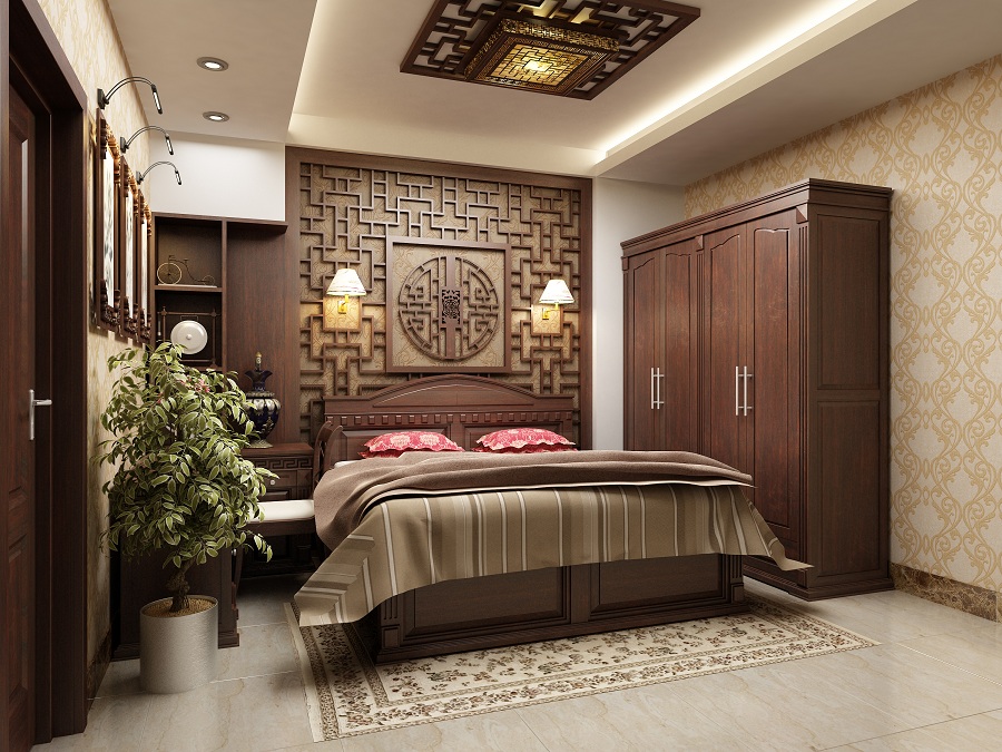 Hình ảnh phòng ngủ ông bà với tường đầu giường ốp gỗ chạm khắc tinh xảo, tủ quần áo gỗ lớn, tranh treo tường