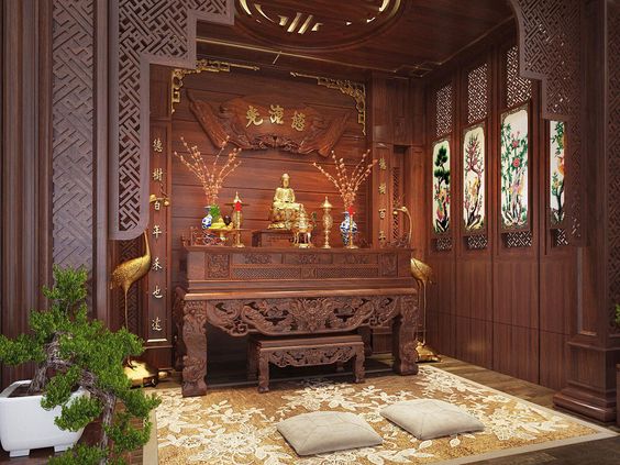 Hình ảnh phòng thờ với nội thất gỗ tự nhiên chạm trổ tinh tế, bài trí ảnh Phật, bình hoa đối xứng