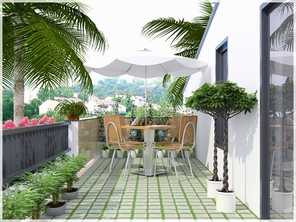 Hình ảnh không gian thư giãn trên ban công tầng 3 biệt thự với bộ bàn ghế nhỏ, xung quanh trồng cây xanh