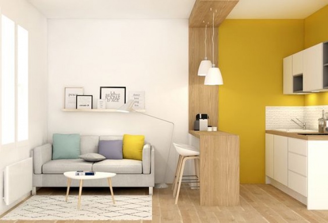 Hình ảnh phòng bếp căn hộ studio ấn tượng với bức tường màu vàng chanh