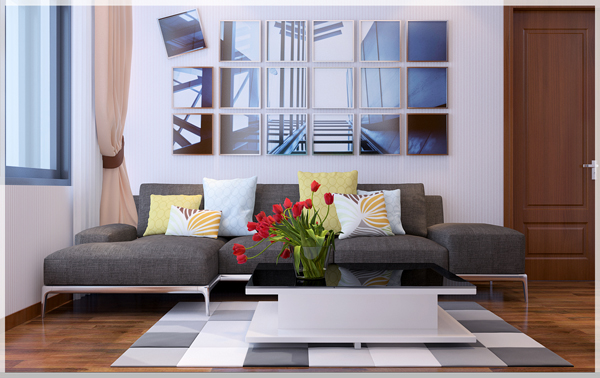 Hình ảnh toàn cảnh phòng sinh hoạt gia đình với sofa xám, bàn trà mặt meka đặt trên thảm trải hình học