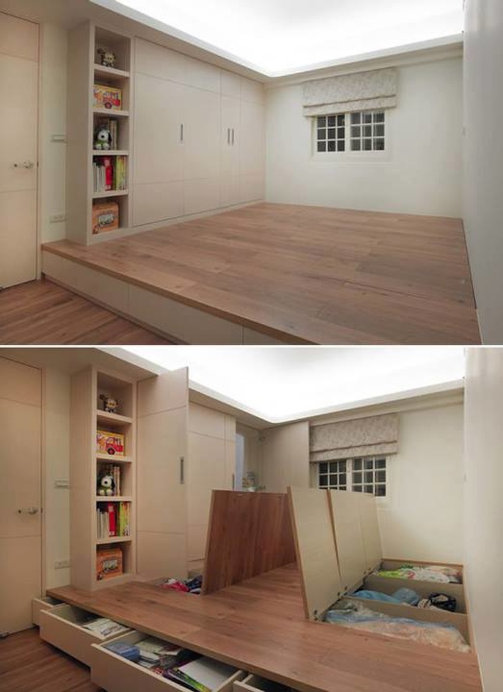Hình ảnh cận cảnh sàn gỗ nâng cao, phía dưới là ngăn kéo, hộc lưu trữ, cạnh đó là tủ kệ cao kịch trần