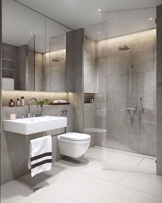 Hình ảnh phòng tắm nhà ống 3 tầng tông màu xám với vách kính phân tách giữa khu tắm đứng và vệ sinh