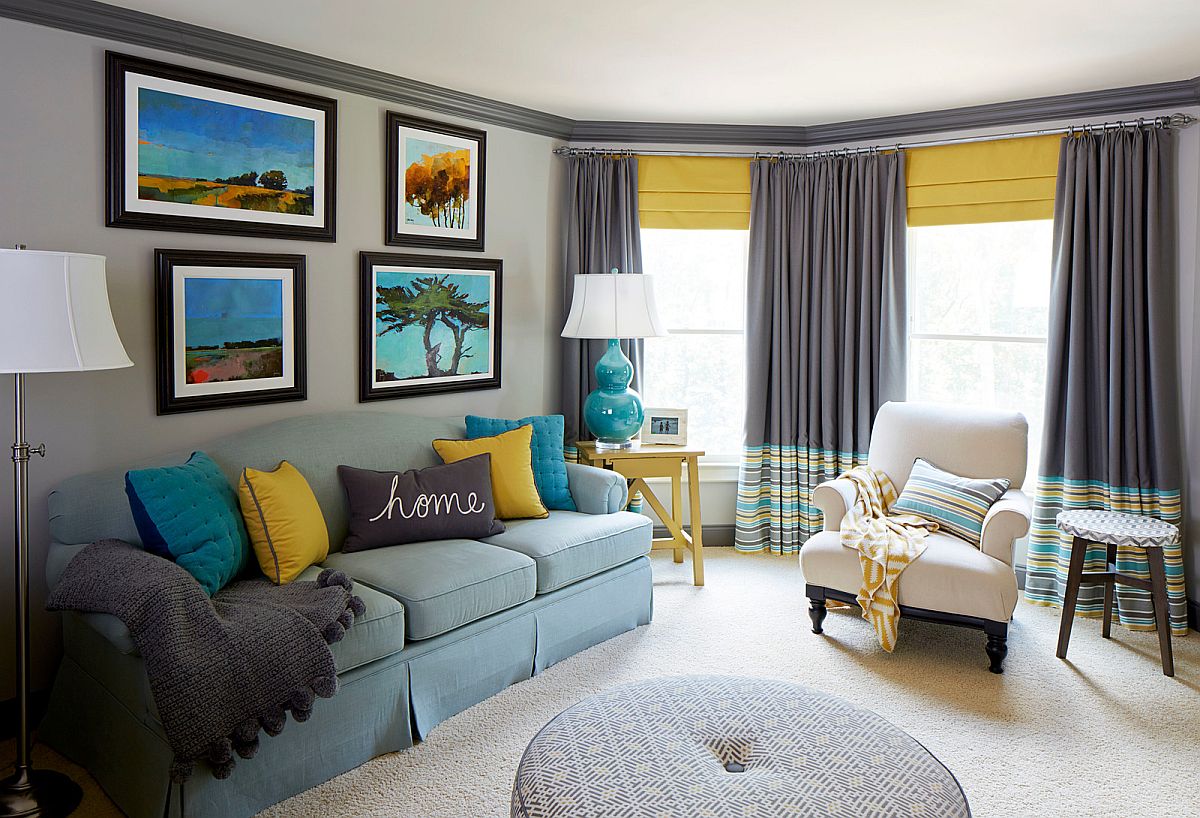 hình ảnh phòng khách hiện đại với những điểm nhấn trang trí màu vàng xanh từ tranh treo tường, gooisi tựa, rừm cửa...