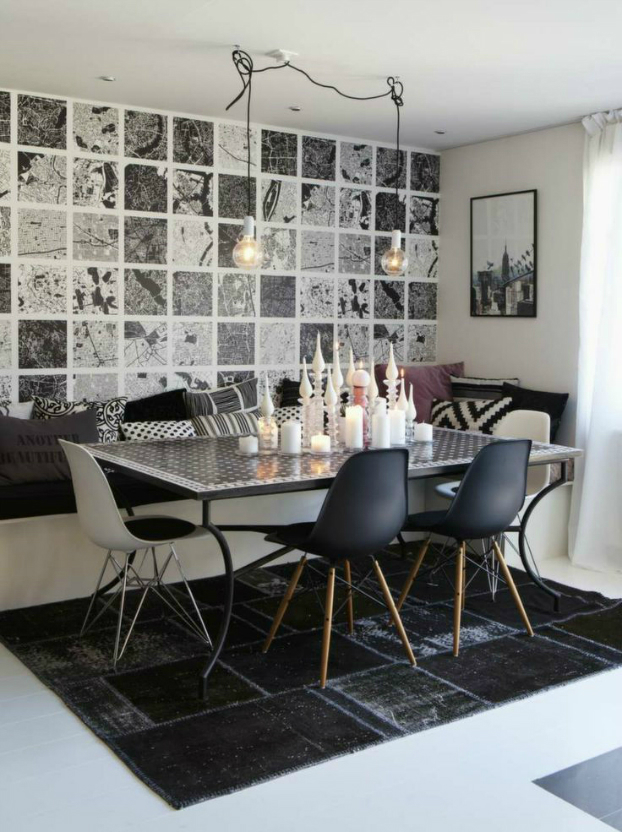 hình ảnh phòng ăn nhỏ với tường ốp gạch đen trắng, đèn thả sợi đốt