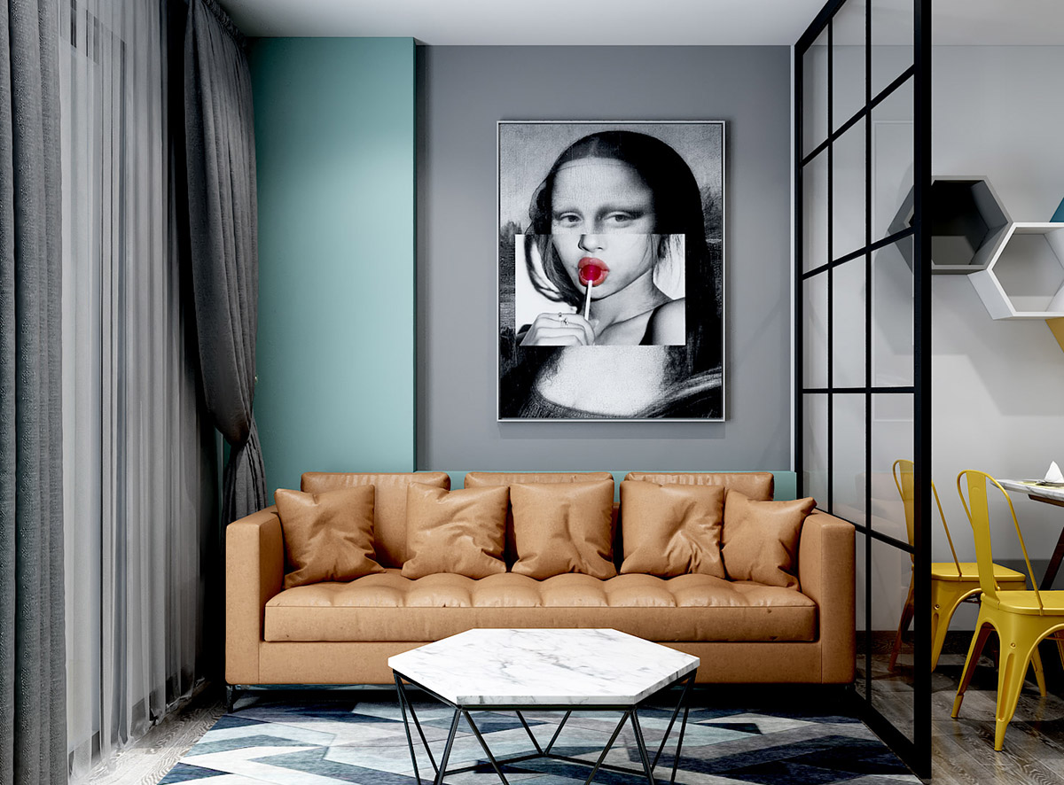Phòng khách căn hộ nhỏ hút mắt với tác phẩm nghệ thuật kỳ quặc, nổi bật trên nền tường màu xám và xanh ngọc lam. Bàn cà phê bằng đá cẩm thạch trắng kết hợp ăn ý với ghế sofa.
