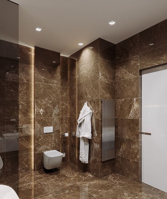 hình ảnh phòng tắm màu nâu hiện đại với tường, sàn ốp lát gạch đá cẩm thạch làm nền cho nội thất màu trắng và chất liệu thép không gỉ nổi bật hơn.