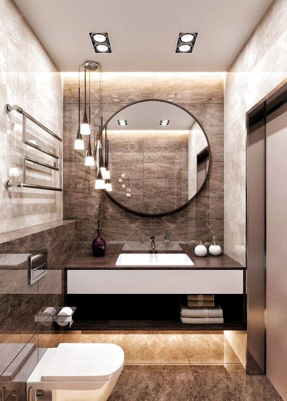 hình ảnh phòng tắm với gạch ốp lát giả đá màu nâu, gương tròn, đèn kiểu dáng đẹp