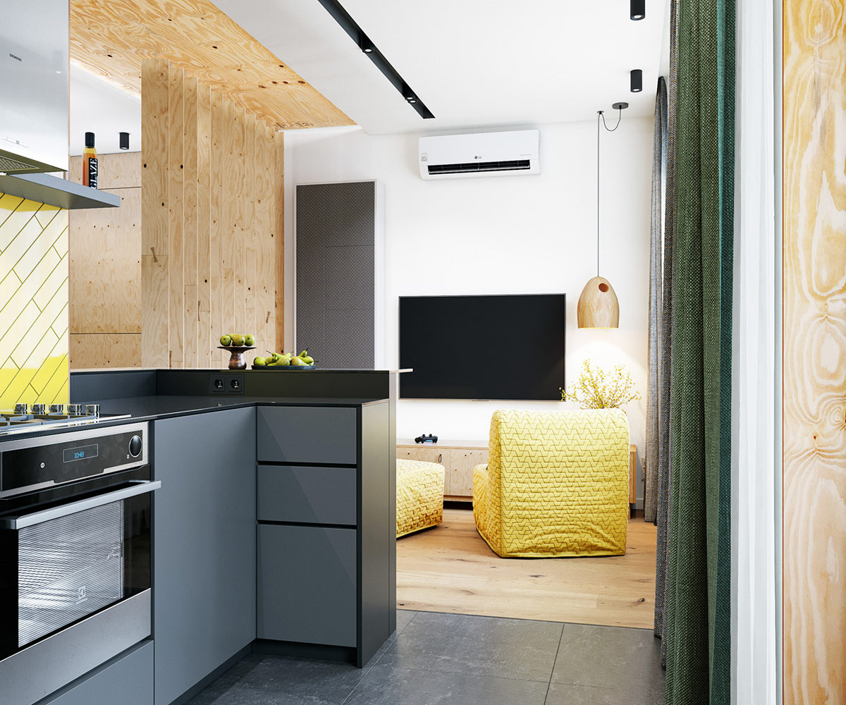 hình ảnh góc phòng bếp căn hộ nhỏ với hệ tủ màu xám, rèm cửa màu xanh lá