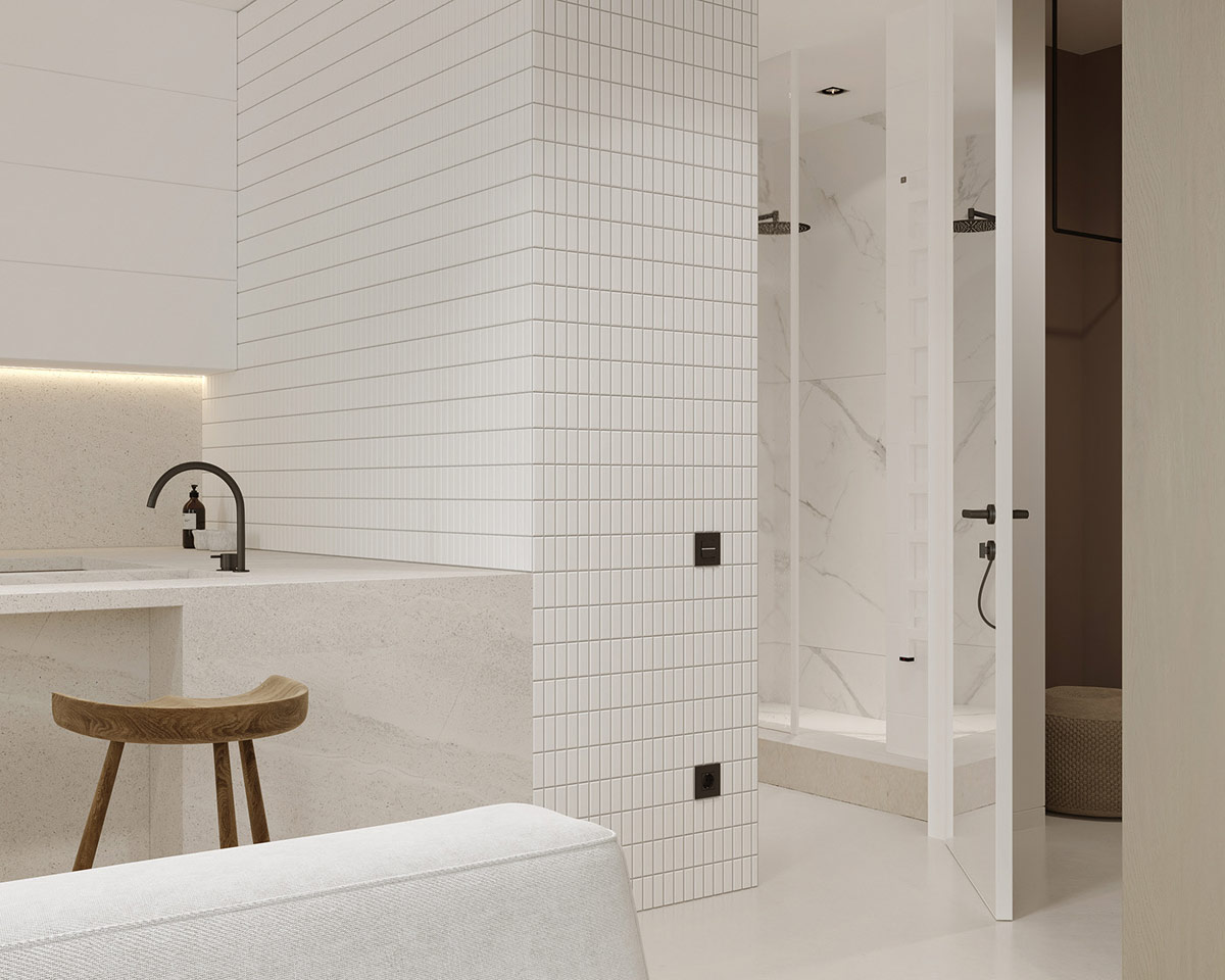 hình ảnh cận cảnh bức tường ốp gạch thẻ màu trắng phân chia giữa bếp và phòng tắm
