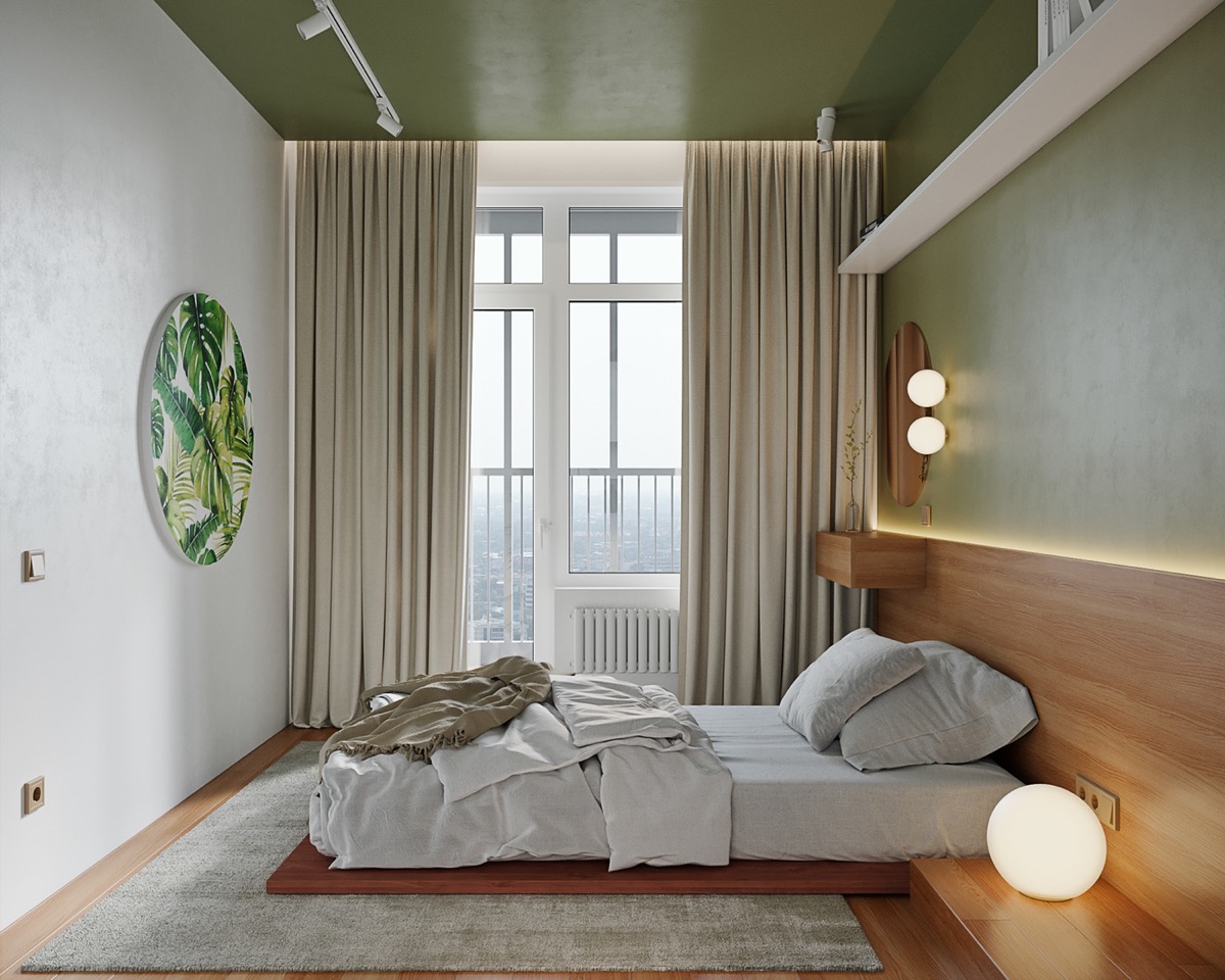 hình ảnh phòng ngủ với giường phản thấp sàn, tranh lá cây nhiệt đới, cửa sổ kính lớn