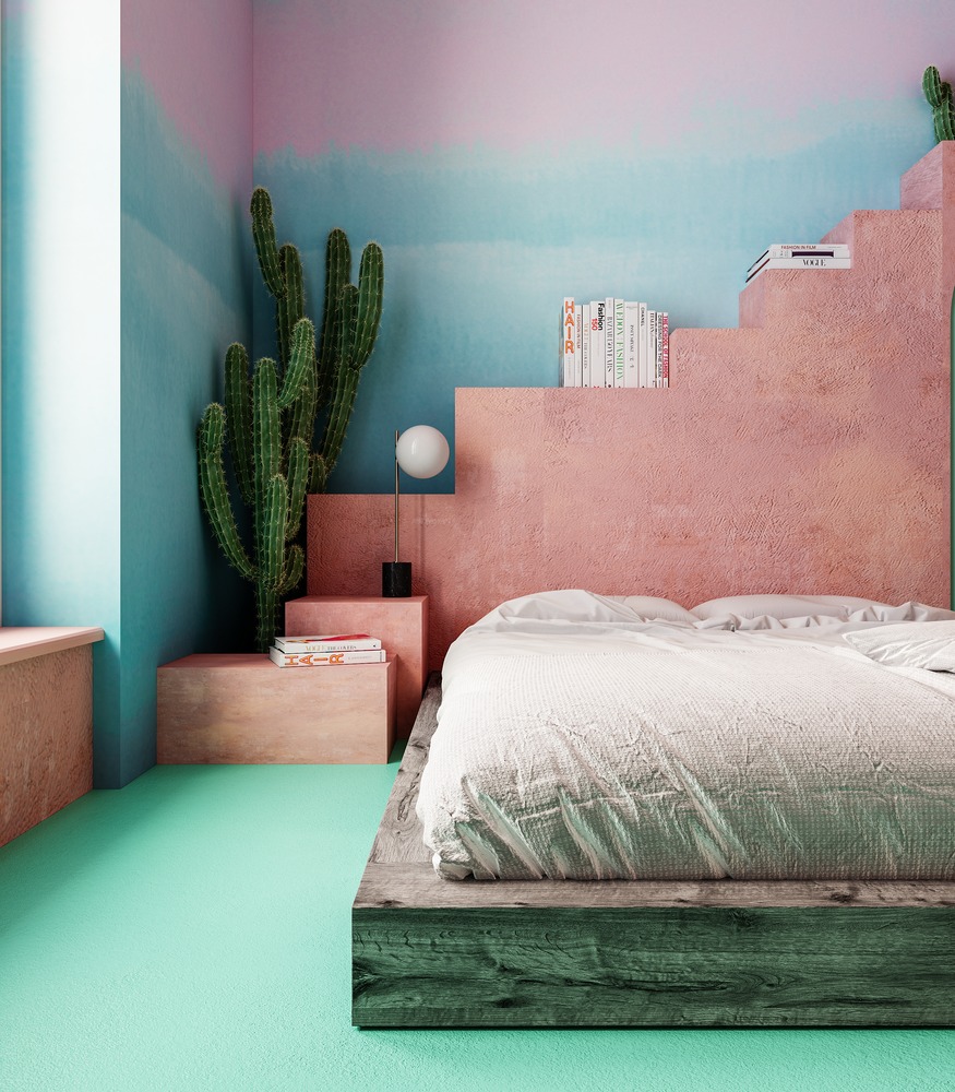 hình ảnh một góc phòng ngủ ấn tượng với đầu giường là những bậc thang màu hồng đất, cây xương rồng đặt ở góc