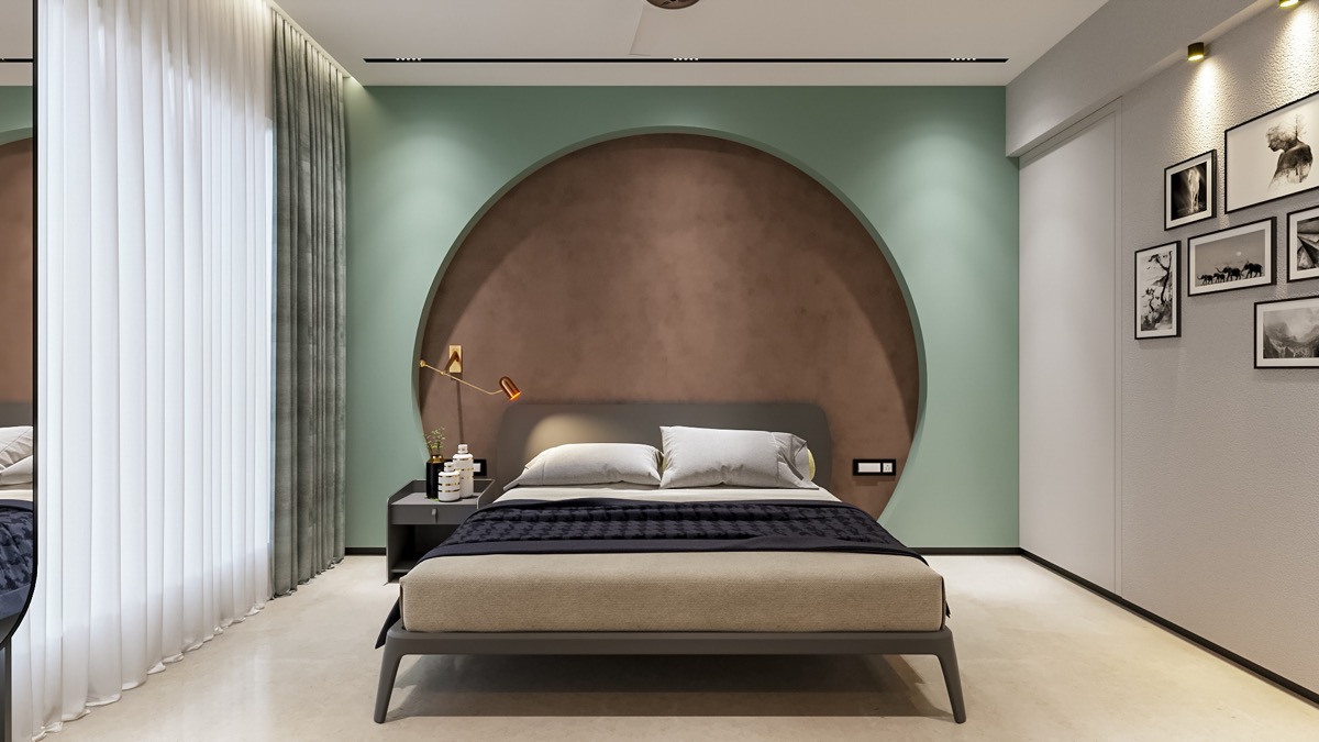 hình ảnh phòng ngủ nổi bật với tường đầu giường màu xanh bạc hà, vòng tròn màu nâu ấn tượng